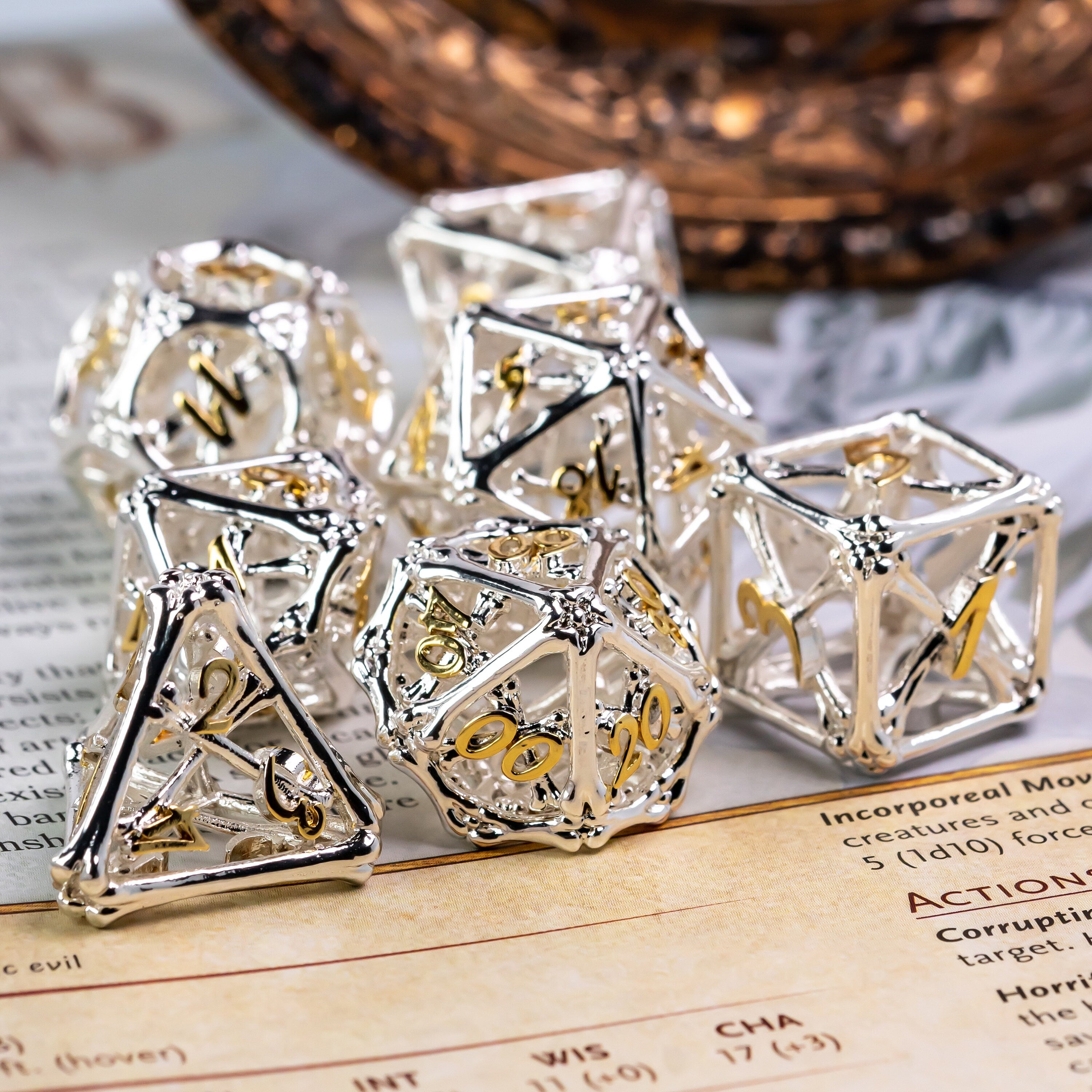 Hollow Shiny Silver and Gold Bones Metal DND/TTRPG Dice set - Dicemaniac