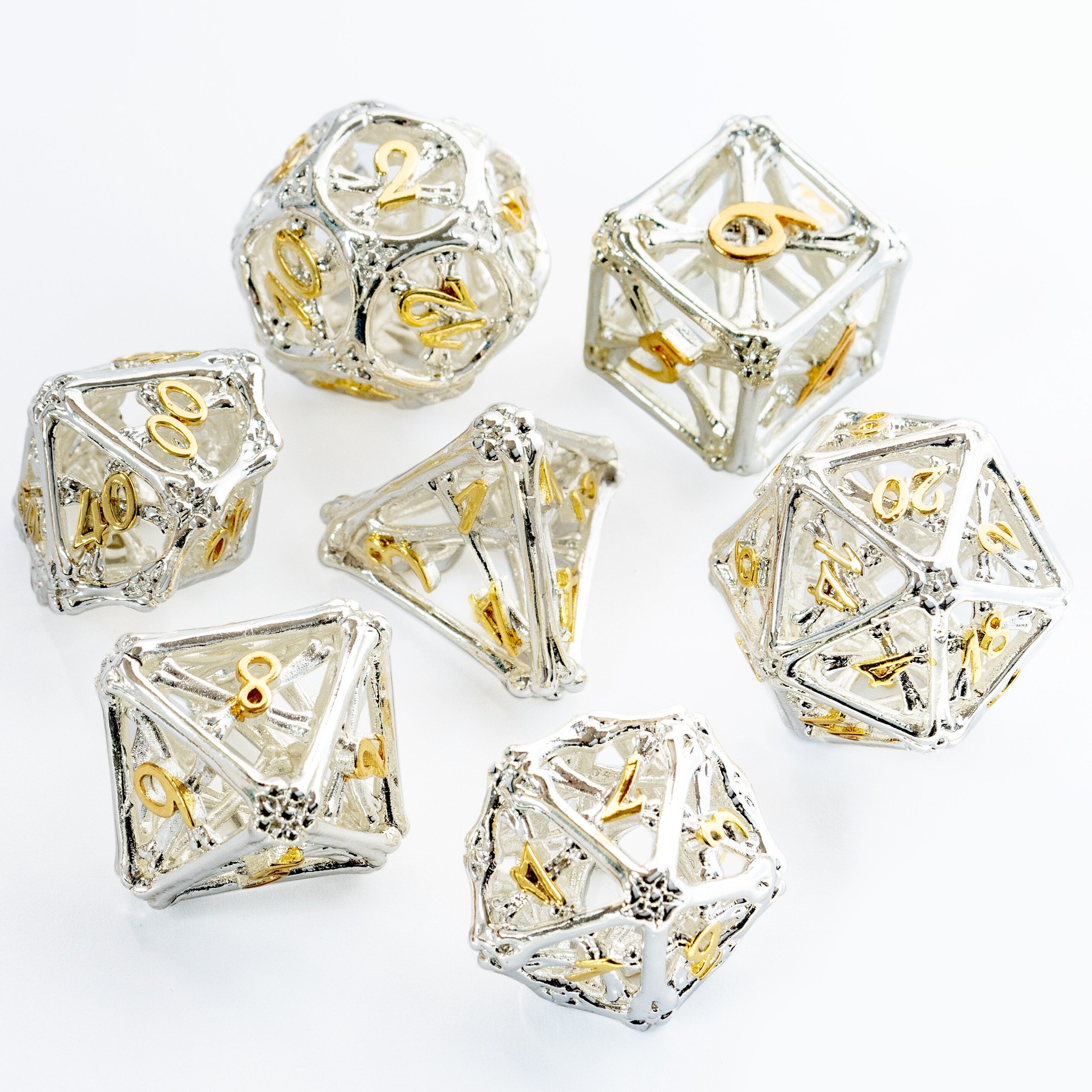 Hollow Shiny Silver and Gold Bones Metal DND/TTRPG Dice set - Dicemaniac